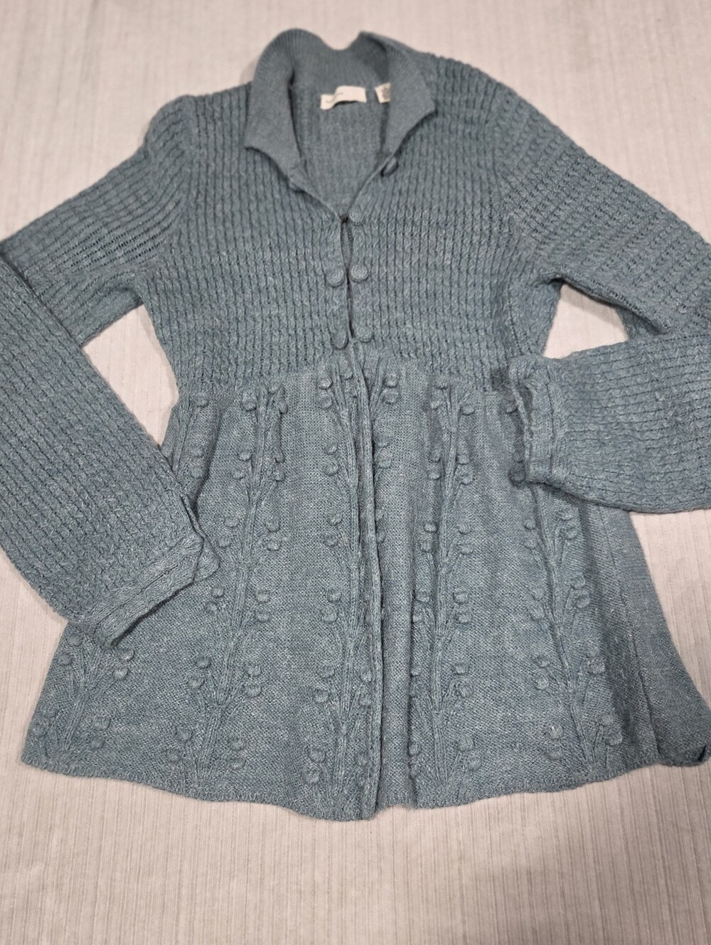 Antropologie vintage alpaca and nylon cardigan sleeping on snow